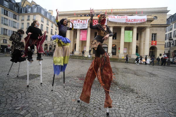 Performers in front of the Odéon Theater in Paris, which workers have occupied since March 4.